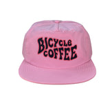 Pink Bicycle Coffee surf hat with stylized Steiner lettering in black and red.